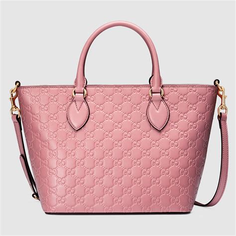 my gucci bag is kinda pinkish not red|Gucci handbags logo.